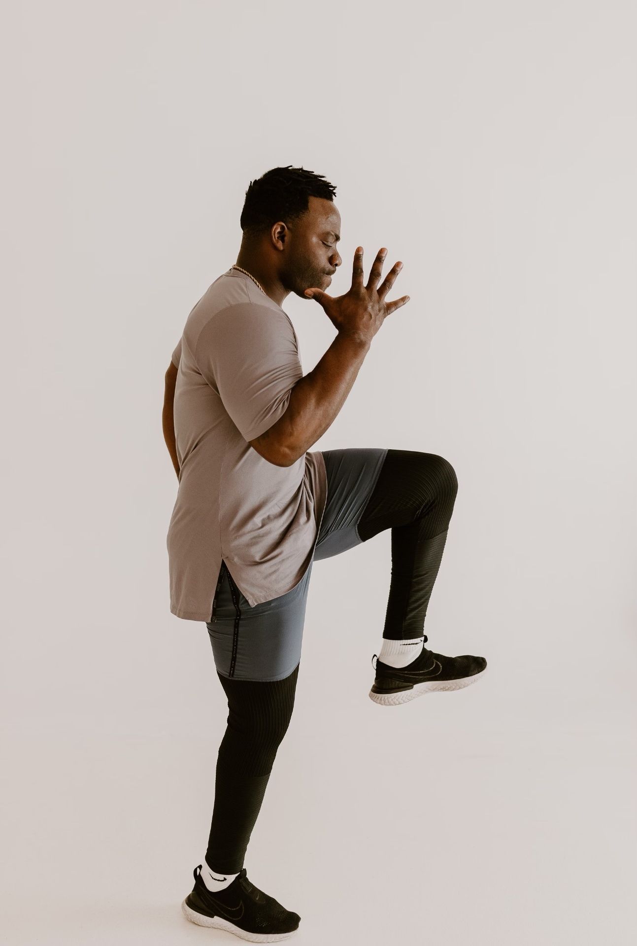 Coach Ben leading a high-knee running drill during speed and agility training in Edmond, Oklahoma